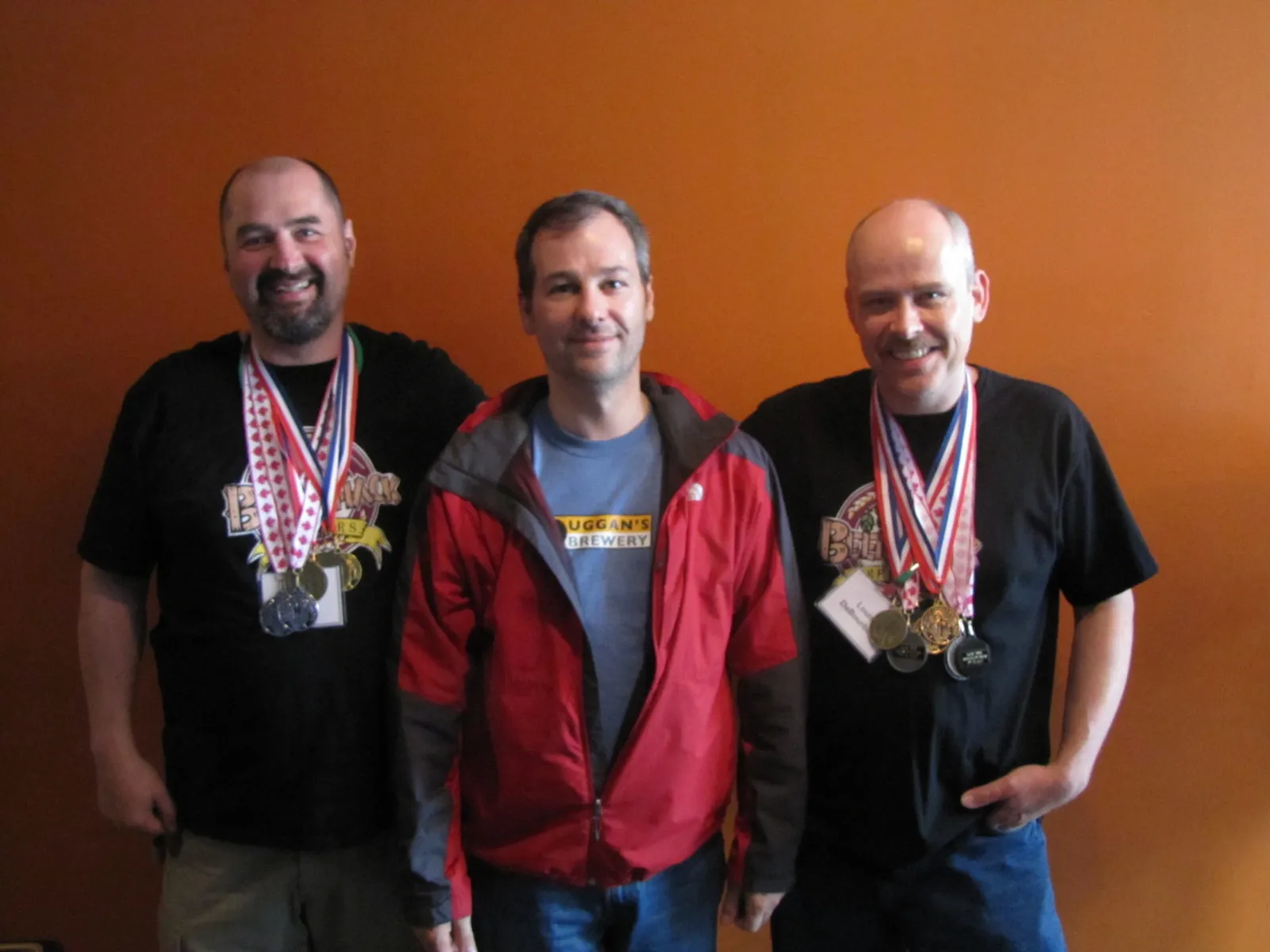 BeerShack co-founders Ed Koren and Louis De Bourbon displaying 100+ national homebrew competition medals